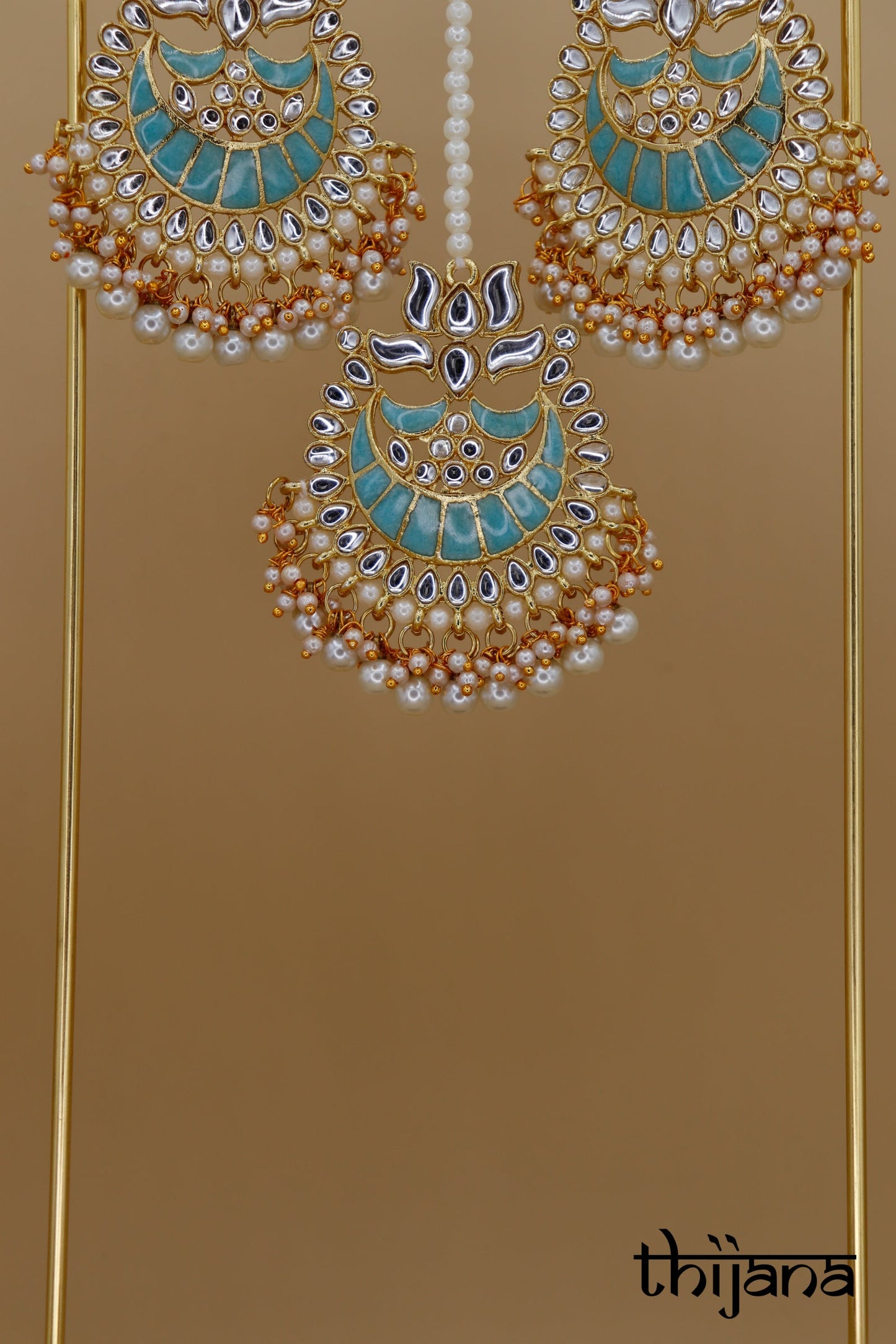 Earrings with matching tikka