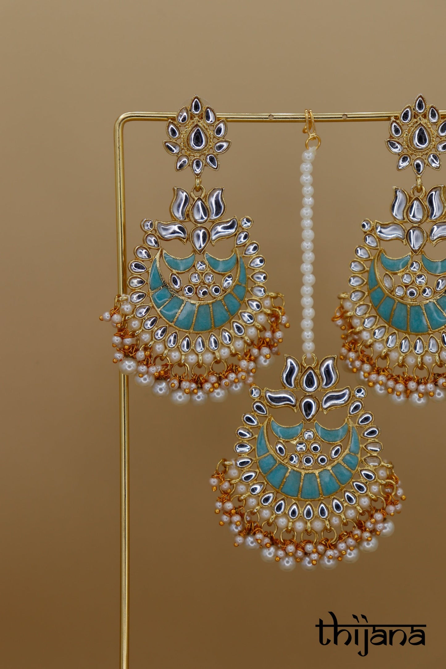Earrings with matching tikka