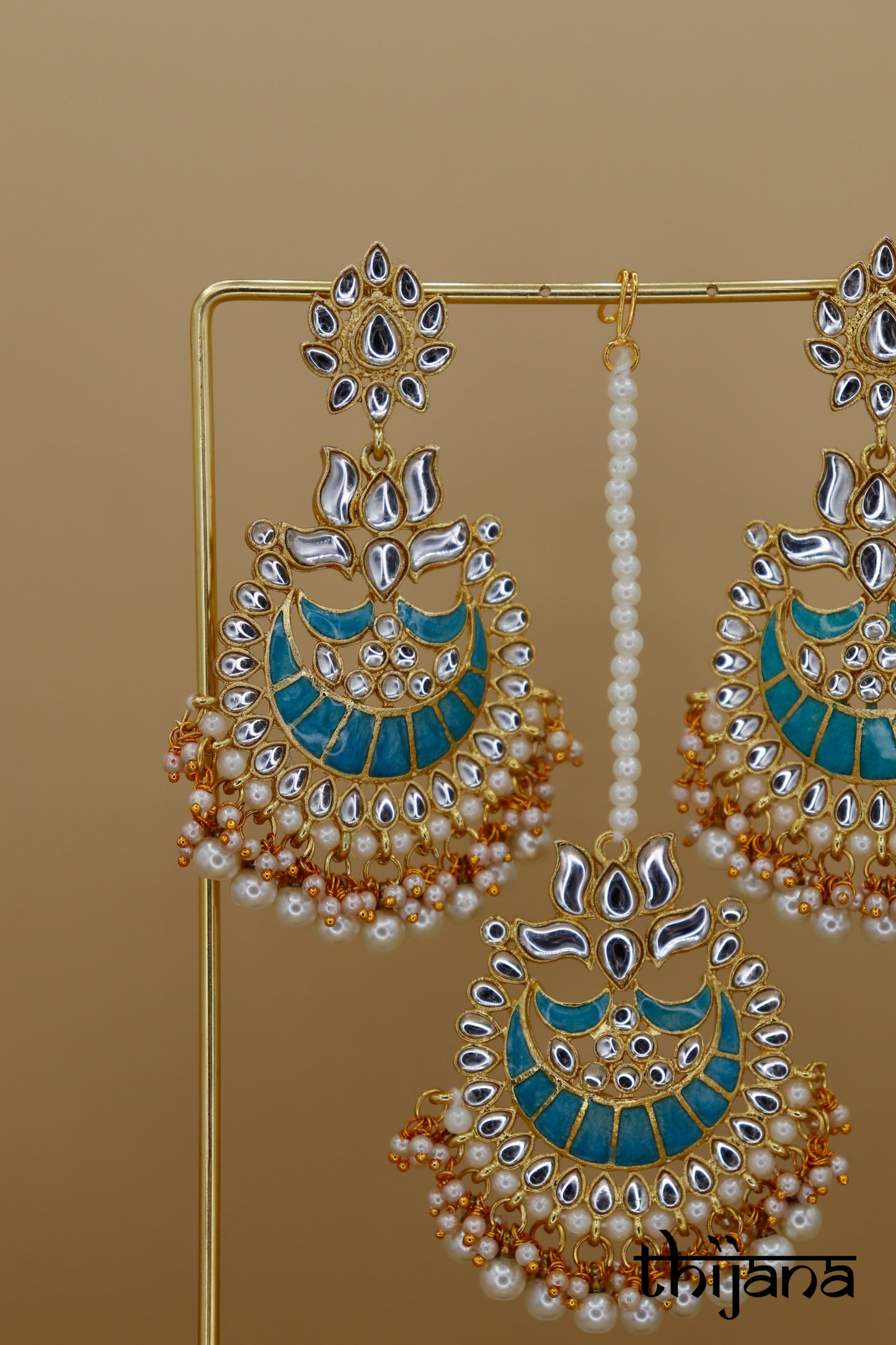 Earrings with matching tikka
