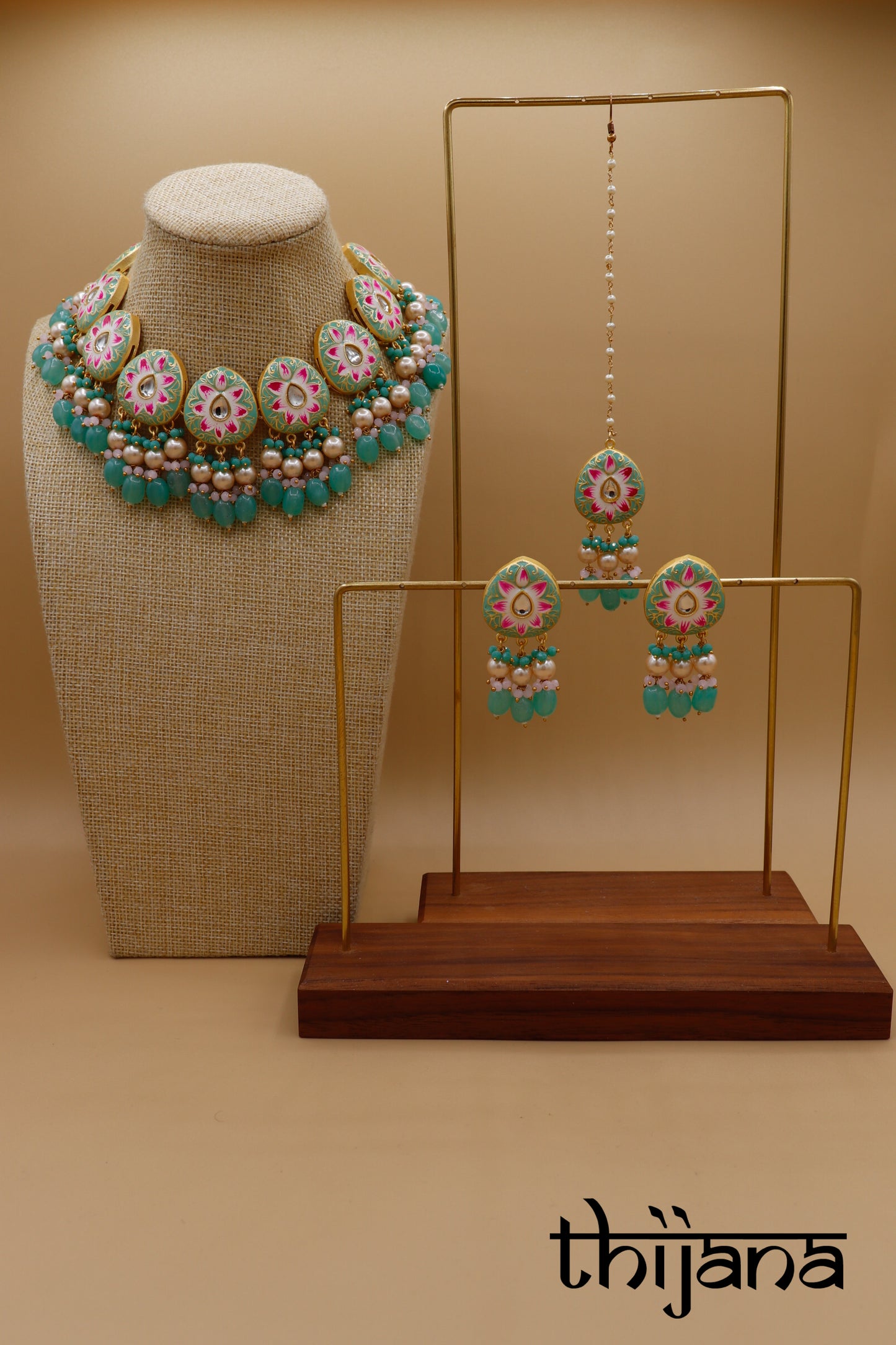 Kundan necklace with matching earrings and tikka
