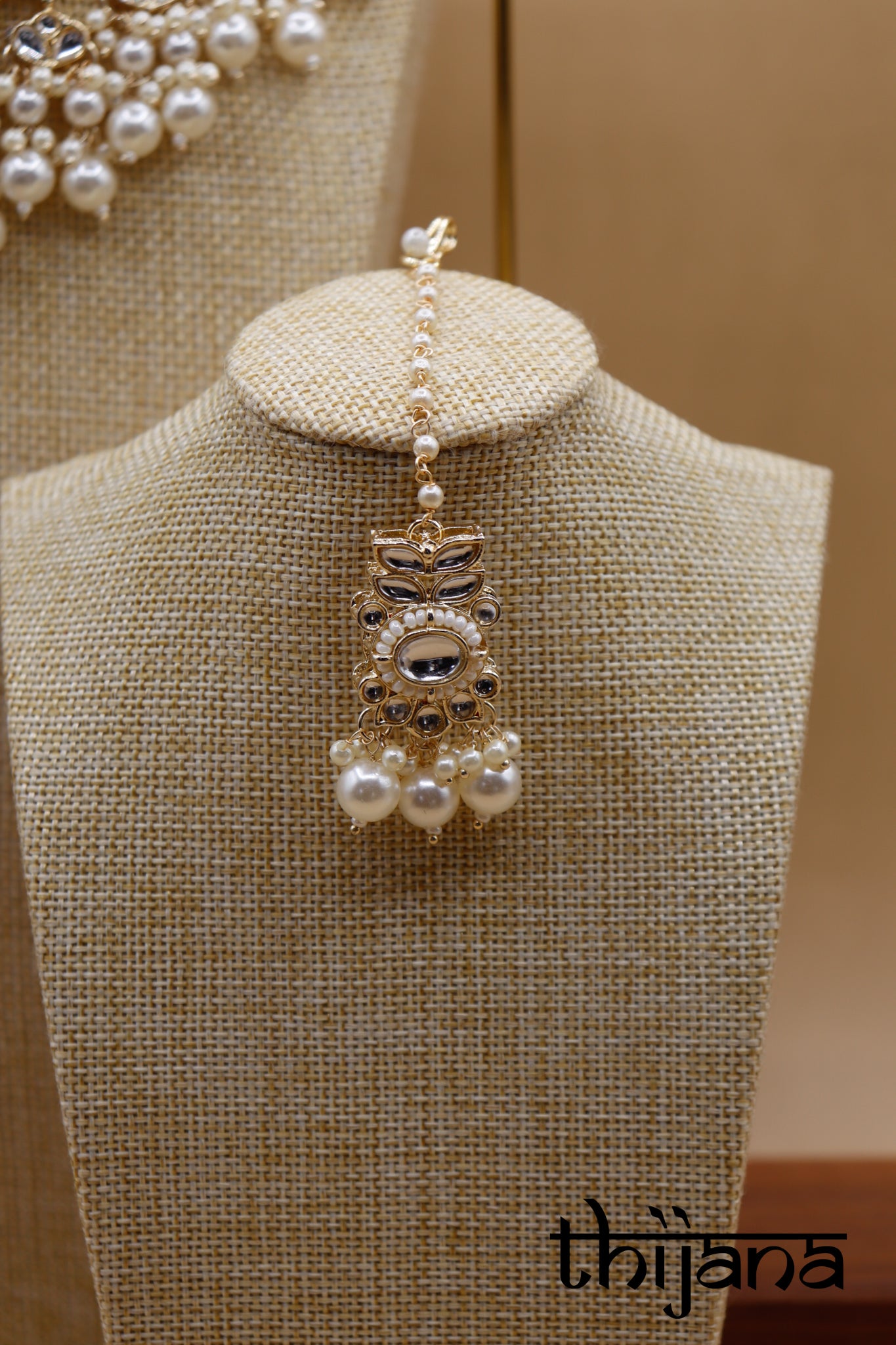 Necklace with matching earrings and tikka