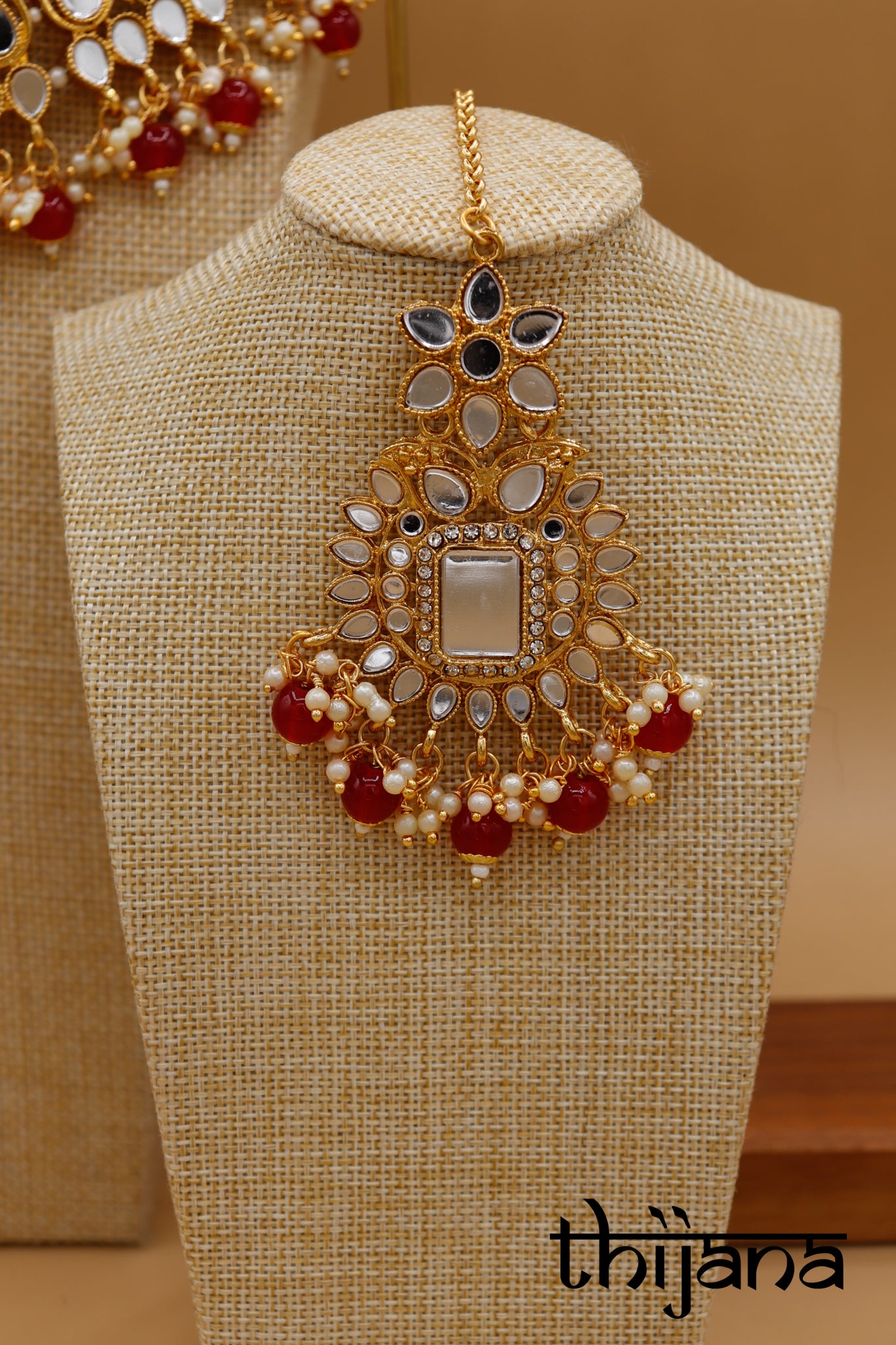Necklace with matching earrings and tikka
