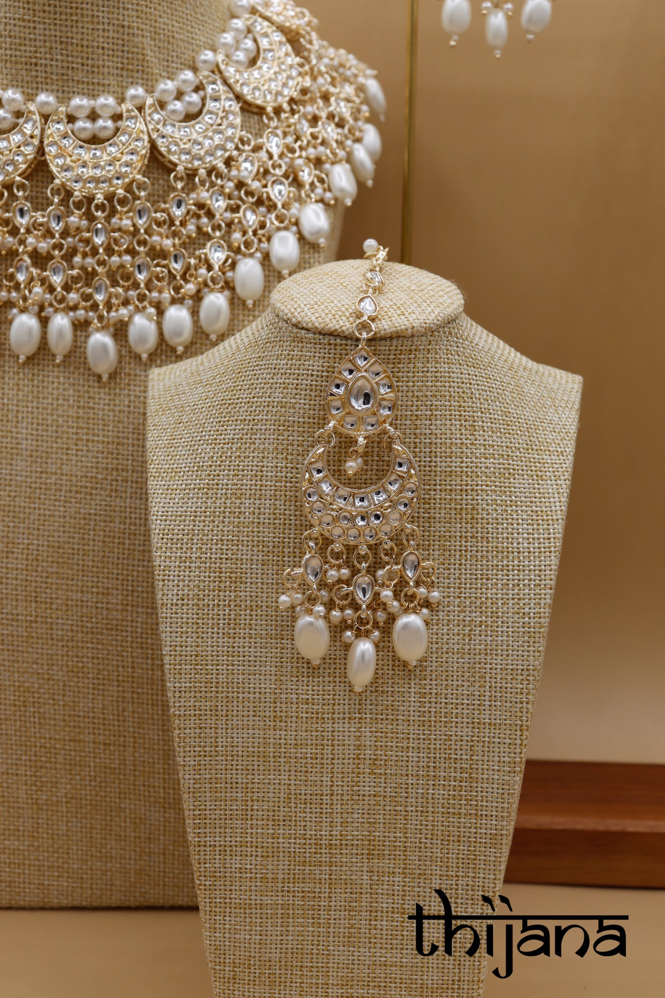 Necklace with matching earrings and tikka