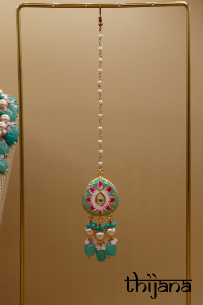 Kundan necklace with matching earrings and tikka
