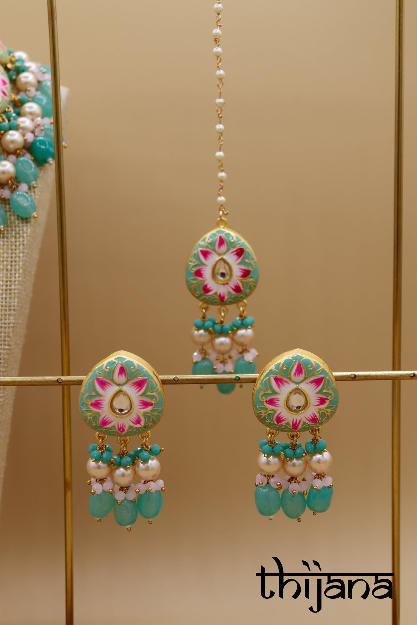 Kundan necklace with matching earrings and tikka